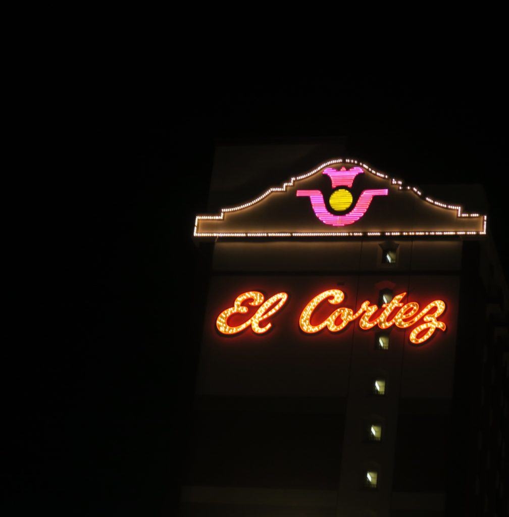 A sign on walking the Las Vegas Strip at night 