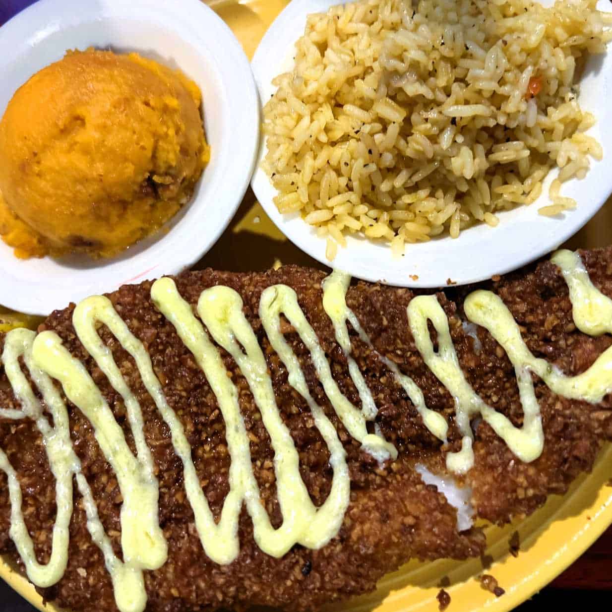 The Pecan-Encrusted fresh catch with sweet potato casserole and rice