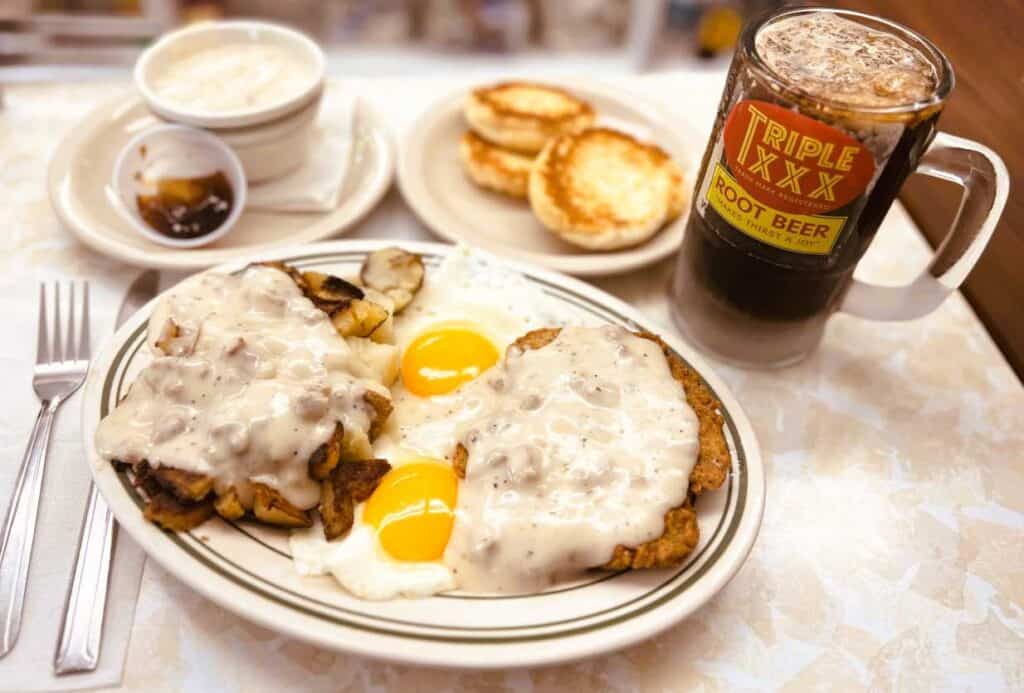 The Drew Brees breakfast at Triple XXX is two eggs, chicken fried steak, fried potatoes with sausage gravy, and two buttermilk biscuits.