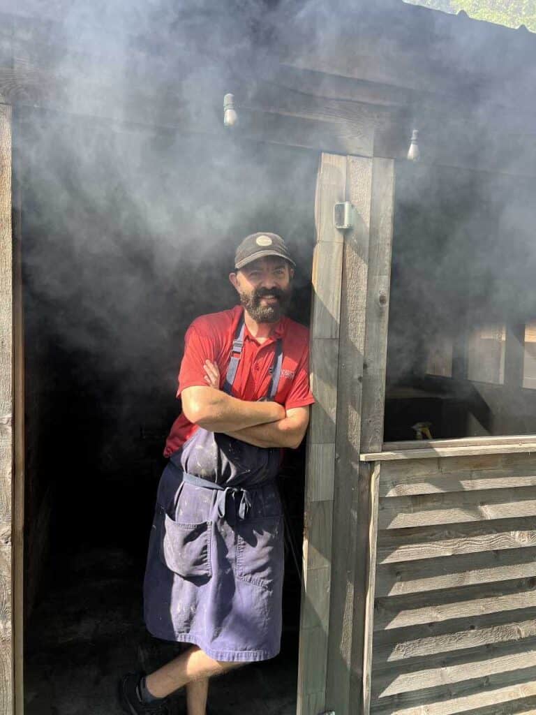 Don Green, the pitmaster at Arcadian Superette one of the best places to eat in Lafayette, Louisiana
