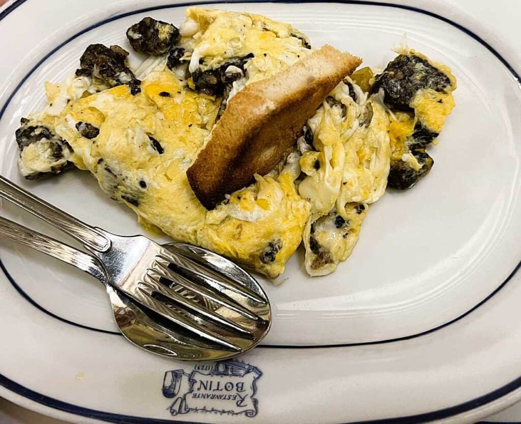 House scrambled eggs with morcilla blood sausage and potato